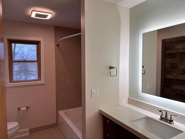 full bathroom with vanity,  shower combination, and toilet