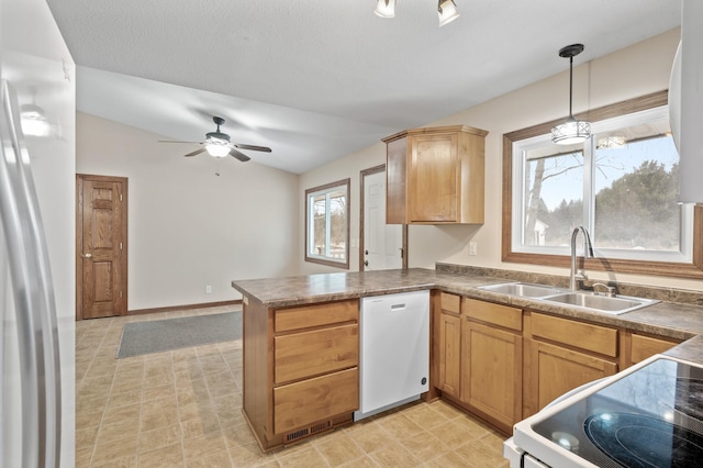 kitchen featuring ceiling fan, sink, kitchen peninsula, pendant lighting, and white appliances