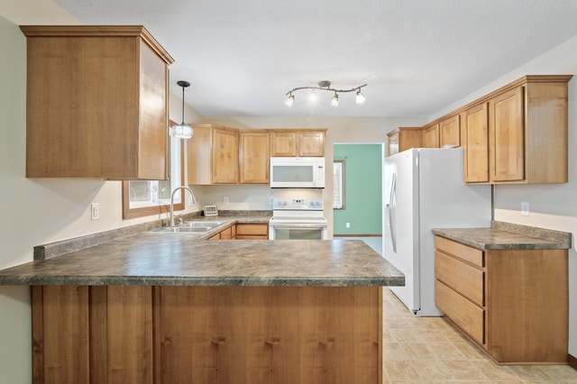 kitchen featuring kitchen peninsula, white appliances, sink, and hanging light fixtures