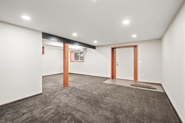 basement with dark colored carpet