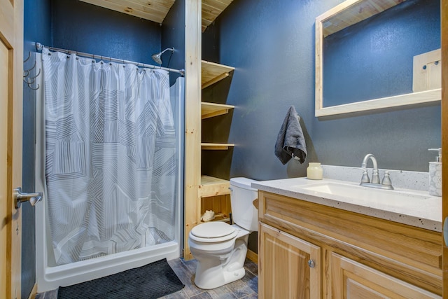 bathroom featuring a shower with curtain, vanity, and toilet