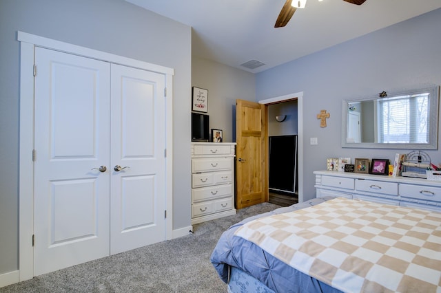 carpeted bedroom with a closet and ceiling fan