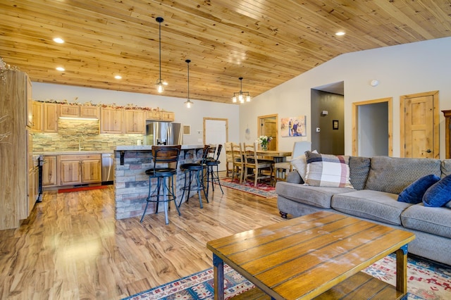 living room featuring light hardwood / wood-style flooring, lofted ceiling, and wood ceiling