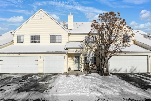 front of property with a garage