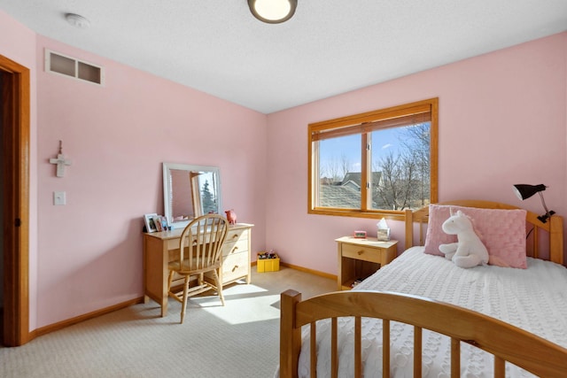 bedroom with light colored carpet, visible vents, and baseboards