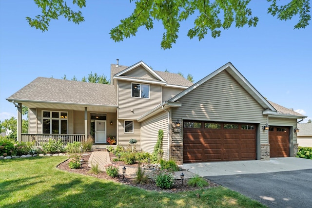 view of front of home featuring aphalt driveway, roof with shingles, covered porch, a front yard, and an attached garage