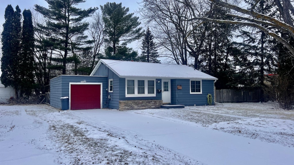 single story home with a garage