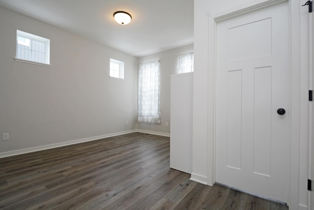 spare room with dark hardwood / wood-style flooring