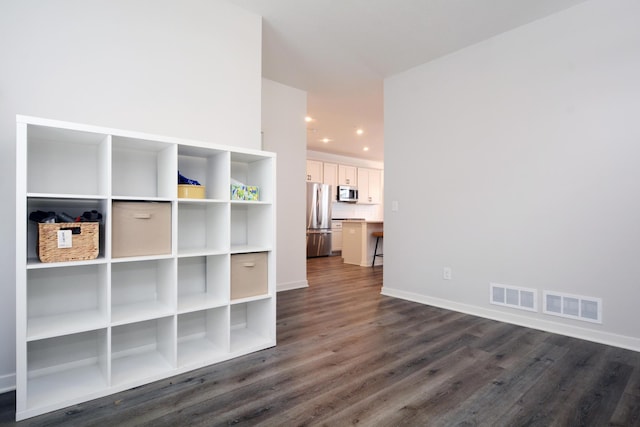 interior space with dark hardwood / wood-style floors