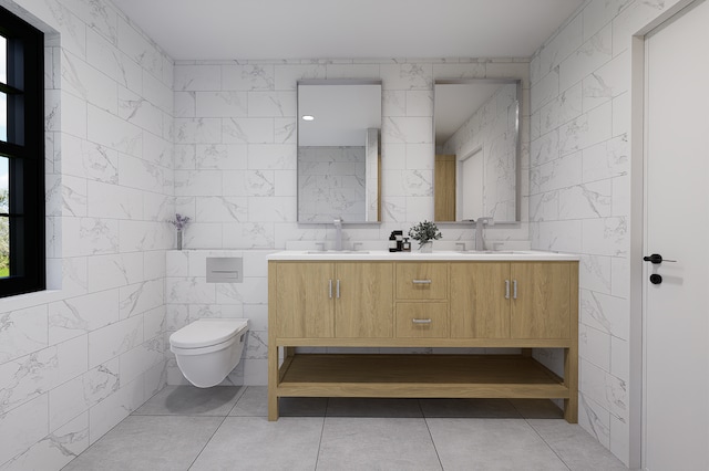 bathroom with toilet, vanity, tile patterned floors, and tile walls