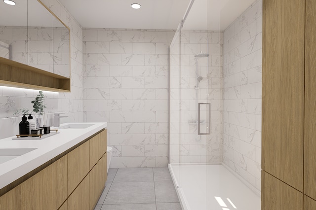 bathroom featuring tile patterned floors, vanity, an enclosed shower, and tile walls