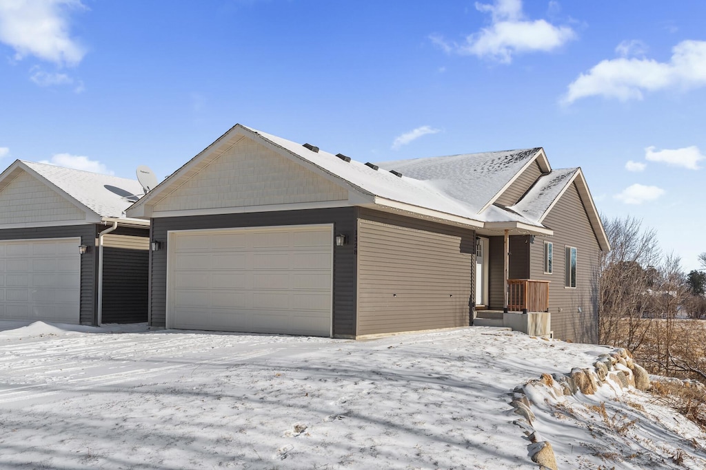 single story home featuring a garage