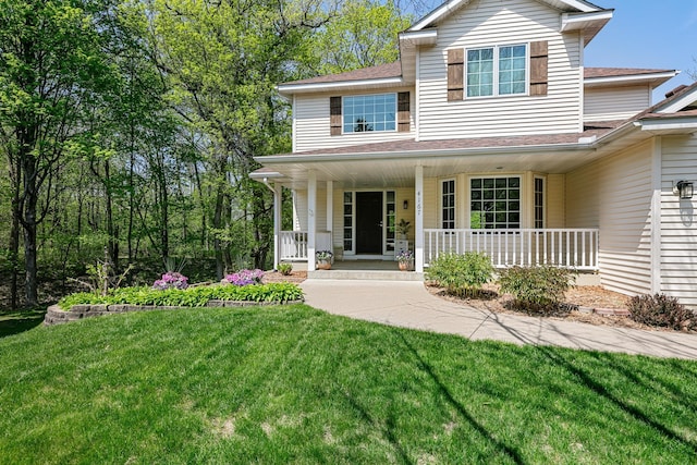4167 Hallgren Ln, Excelsior, MN 55331 - view of front facade with a porch, a front lawn, and a shingled roof