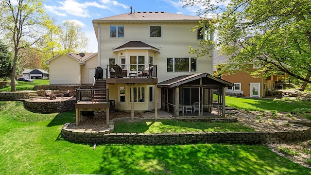 4167 Hallgren Ln, Excelsior, MN 55331 - rear view of house with a wooden deck, a sunroom, a yard, a patio area, and stairs
