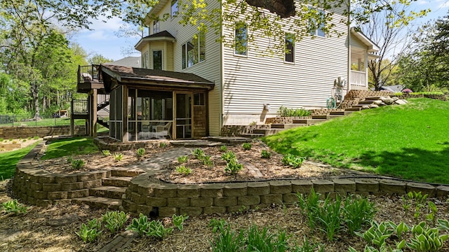 4167 Hallgren Ln, Excelsior, MN 55331 - view of home's exterior with a sunroom, stairs, and a lawn