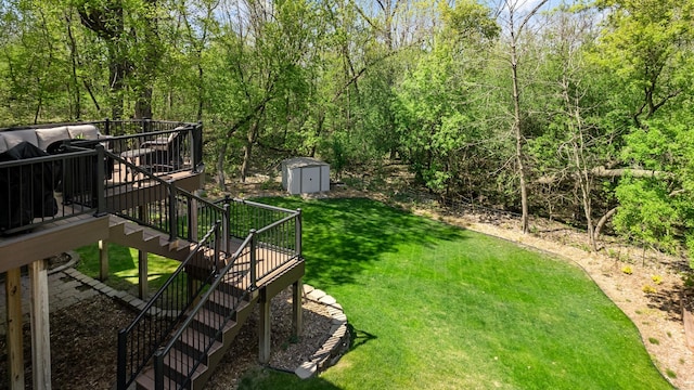 4167 Hallgren Ln, Excelsior, MN 55331 - view of grassy yard with stairway, a storage shed, a wooden deck, and an outbuilding