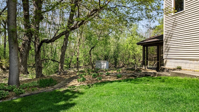 4167 Hallgren Ln, Excelsior, MN 55331 - view of green lawn with an outdoor structure and a storage shed