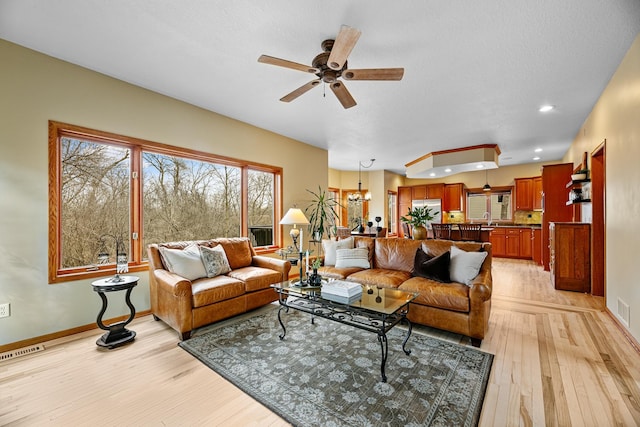 4167 Hallgren Ln, Excelsior, MN 55331 - living area featuring ceiling fan, baseboards, light wood-type flooring, and recessed lighting