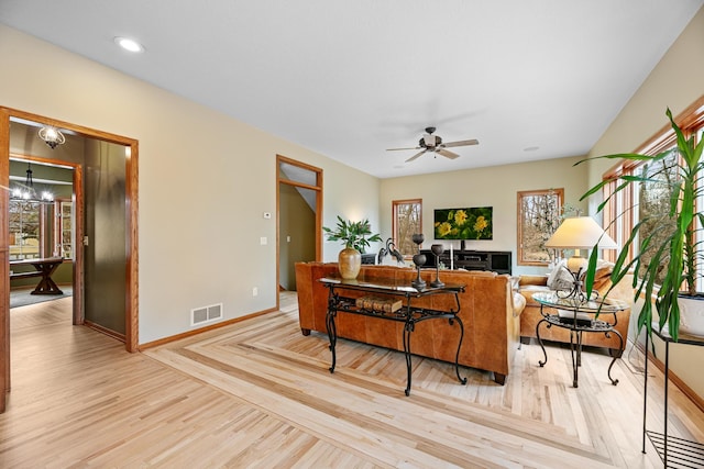 4167 Hallgren Ln, Excelsior, MN 55331 - living room featuring baseboards, ceiling fan, wood finished floors, a chandelier, and recessed lighting