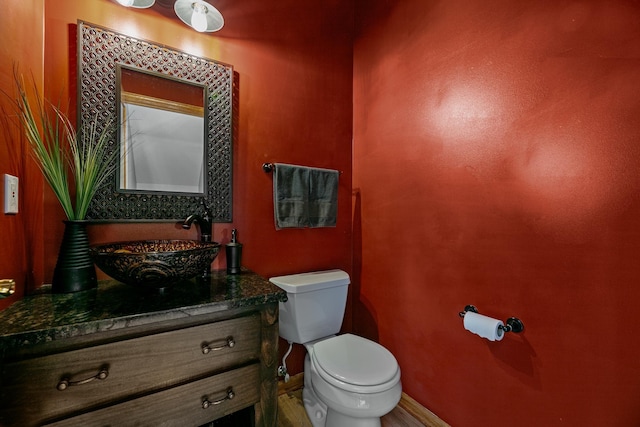 4167 Hallgren Ln, Excelsior, MN 55331 - bathroom with toilet, vanity, and baseboards