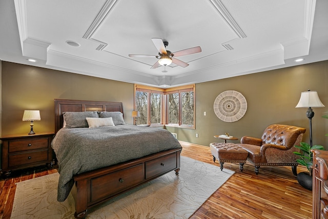 4167 Hallgren Ln, Excelsior, MN 55331 - bedroom with a raised ceiling, crown molding, wood finished floors, baseboards, and ceiling fan