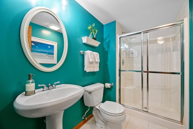 4167 Hallgren Ln, Excelsior, MN 55331 - full bath with tile patterned flooring, a shower stall, toilet, and a textured ceiling