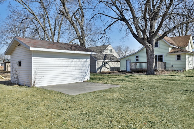 view of yard featuring a patio, an outdoor structure, and a wooden deck