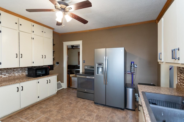 kitchen featuring tasteful backsplash, ornamental molding, visible vents, and stainless steel appliances