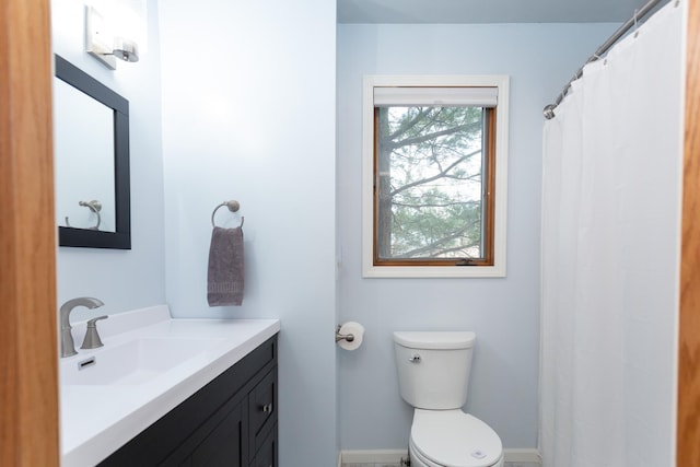 full bath with vanity, a shower with shower curtain, and toilet