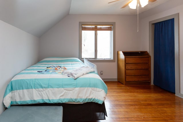 bedroom featuring vaulted ceiling, ceiling fan, and hardwood / wood-style flooring