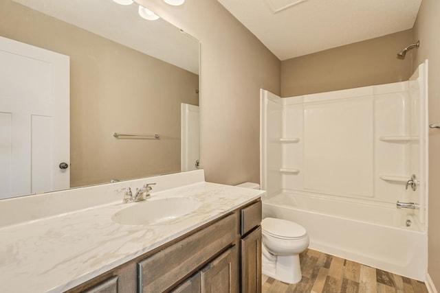 full bathroom with toilet, shower / washtub combination, vanity, and hardwood / wood-style flooring