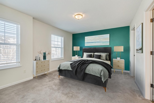 bedroom featuring light carpet