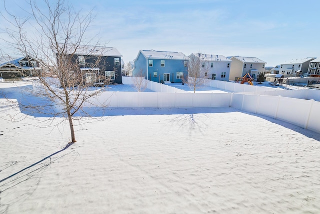 view of yard layered in snow