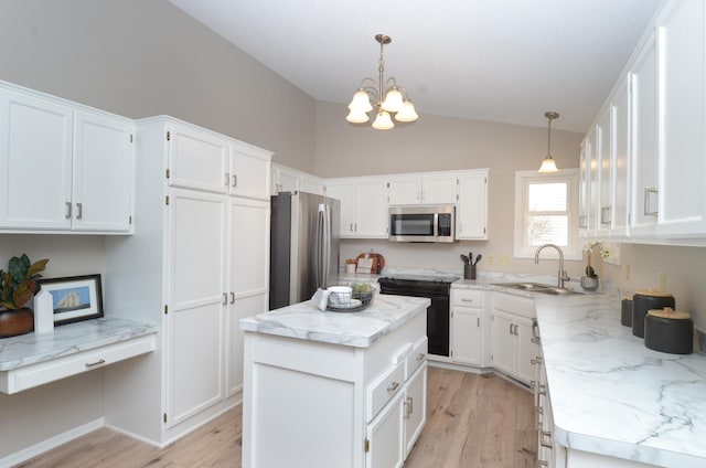 kitchen featuring sink, a center island, pendant lighting, and appliances with stainless steel finishes