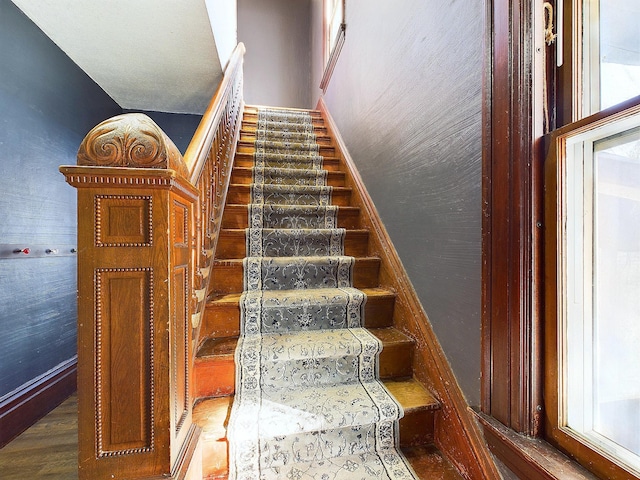 stairs with hardwood / wood-style flooring