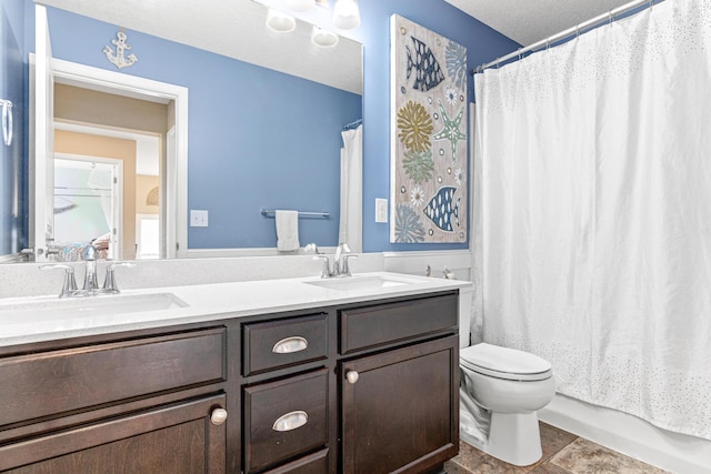 full bathroom with a textured ceiling, vanity, shower / bath combo, and toilet