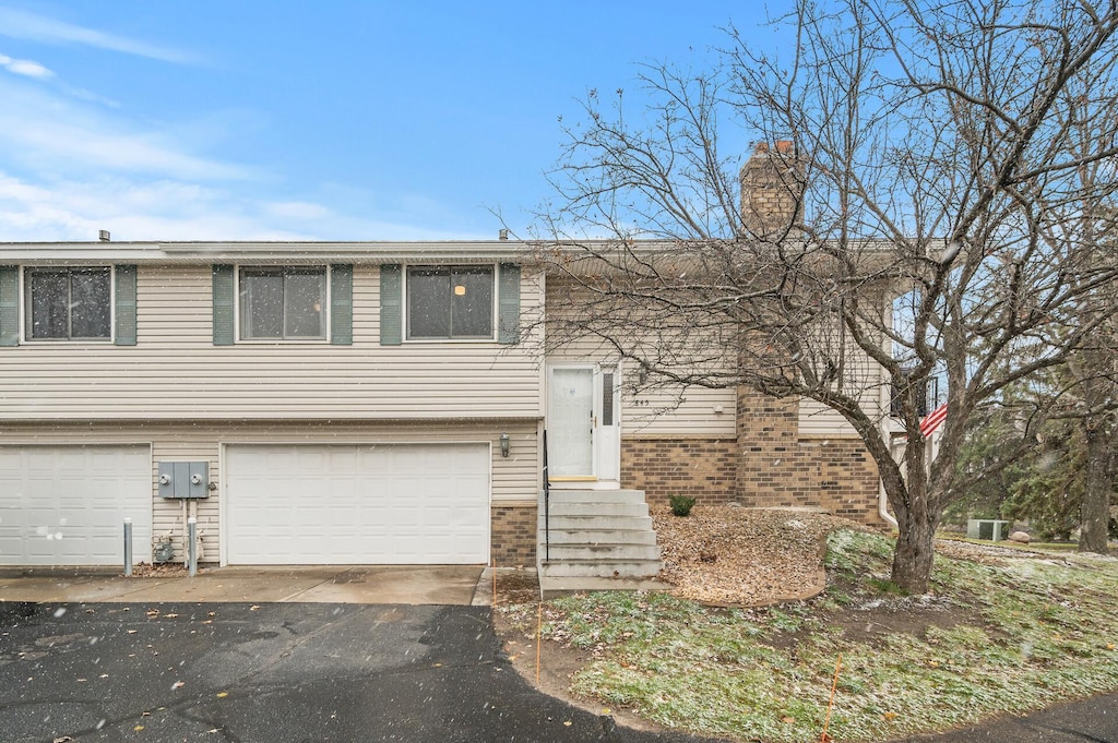 bi-level home featuring a garage