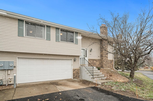 split foyer home featuring a garage