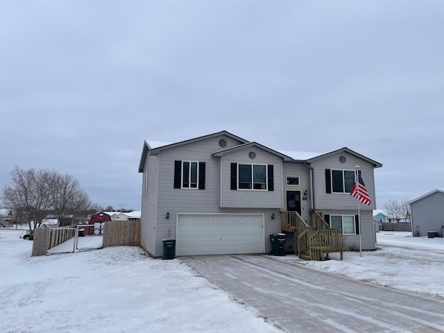 bi-level home featuring a garage