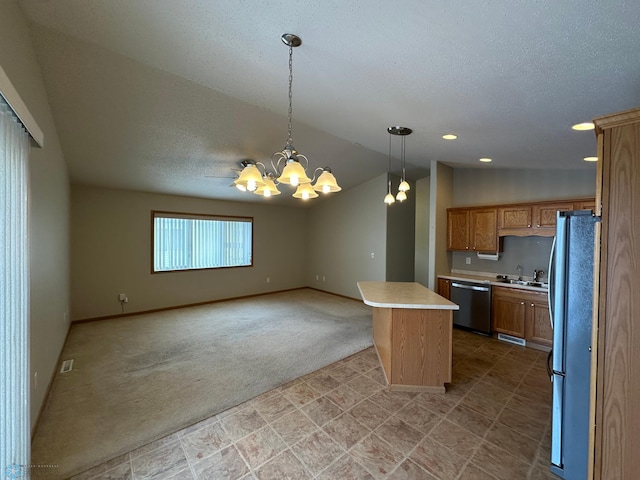 kitchen with vaulted ceiling, dishwasher, a kitchen island, fridge, and hanging light fixtures