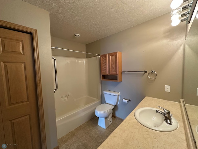 full bathroom with toilet, vanity, shower / bath combination, and a textured ceiling