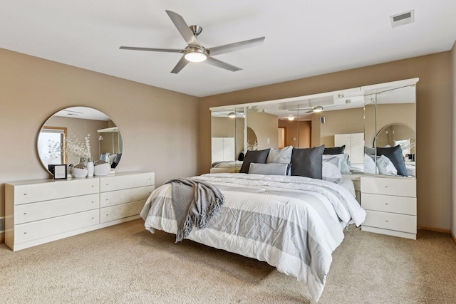 carpeted bedroom with ceiling fan