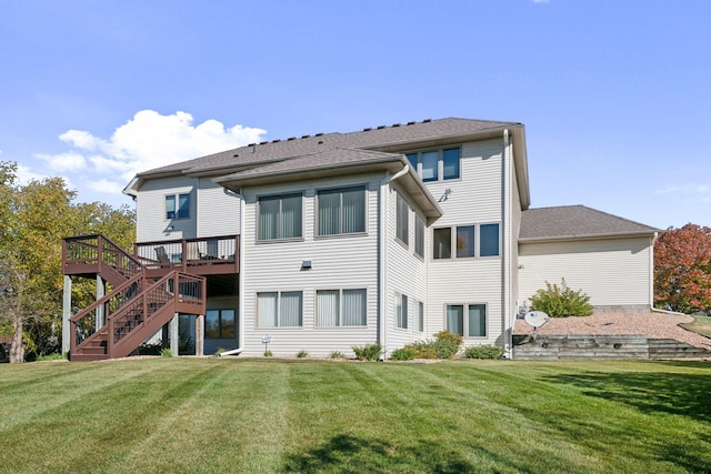 back of house with a lawn and a deck