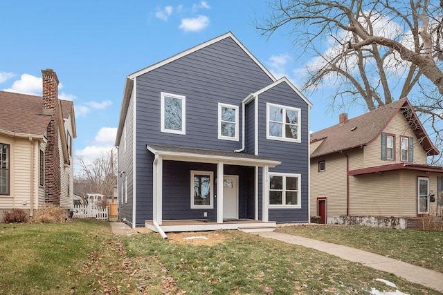 view of front of home with a front lawn and a porch