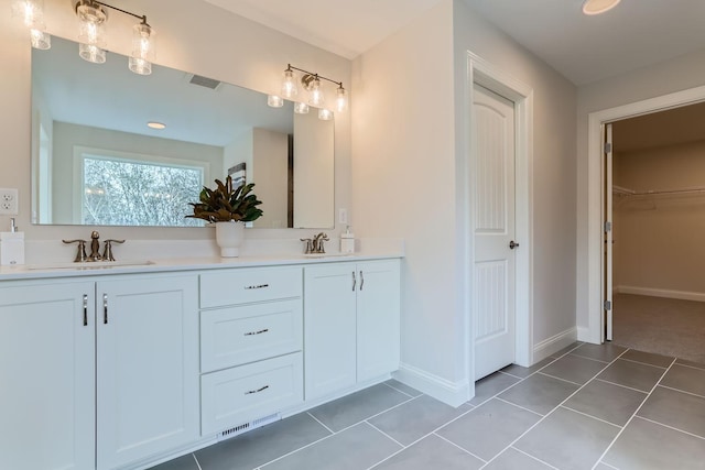 bathroom with tile patterned flooring and vanity