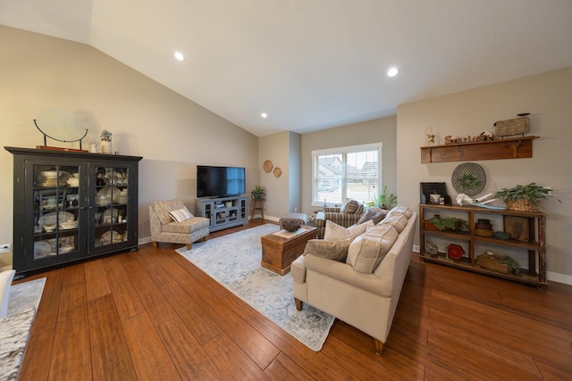 living room with lofted ceiling and dark wood-type flooring