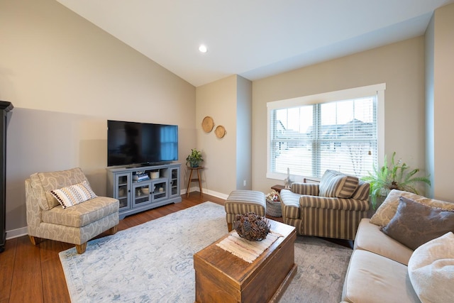 living room with hardwood / wood-style flooring and lofted ceiling