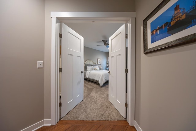 hallway with carpet flooring