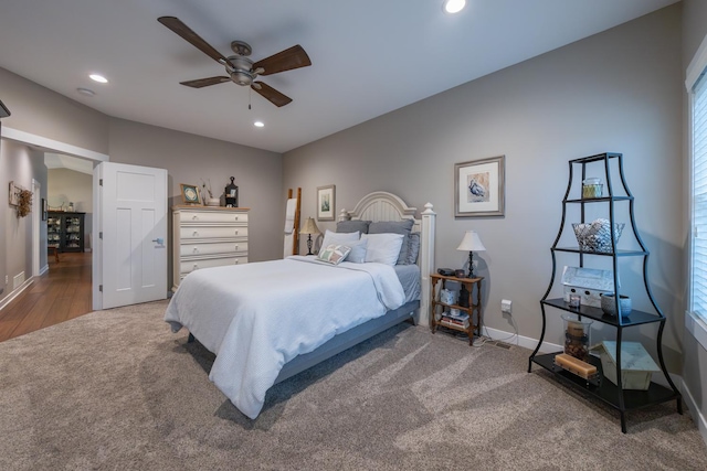 carpeted bedroom with ceiling fan