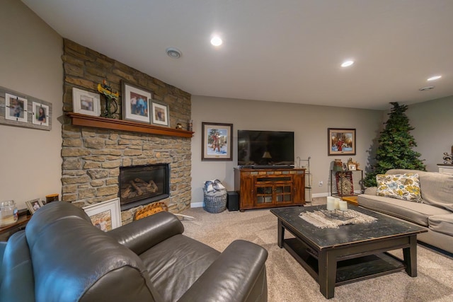 carpeted living room with a fireplace